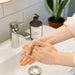 Designer-inspired liquid soap shown in a minimalist vanity scene