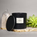 High-end scented wax vessel paired with minimalist styling on a shelf