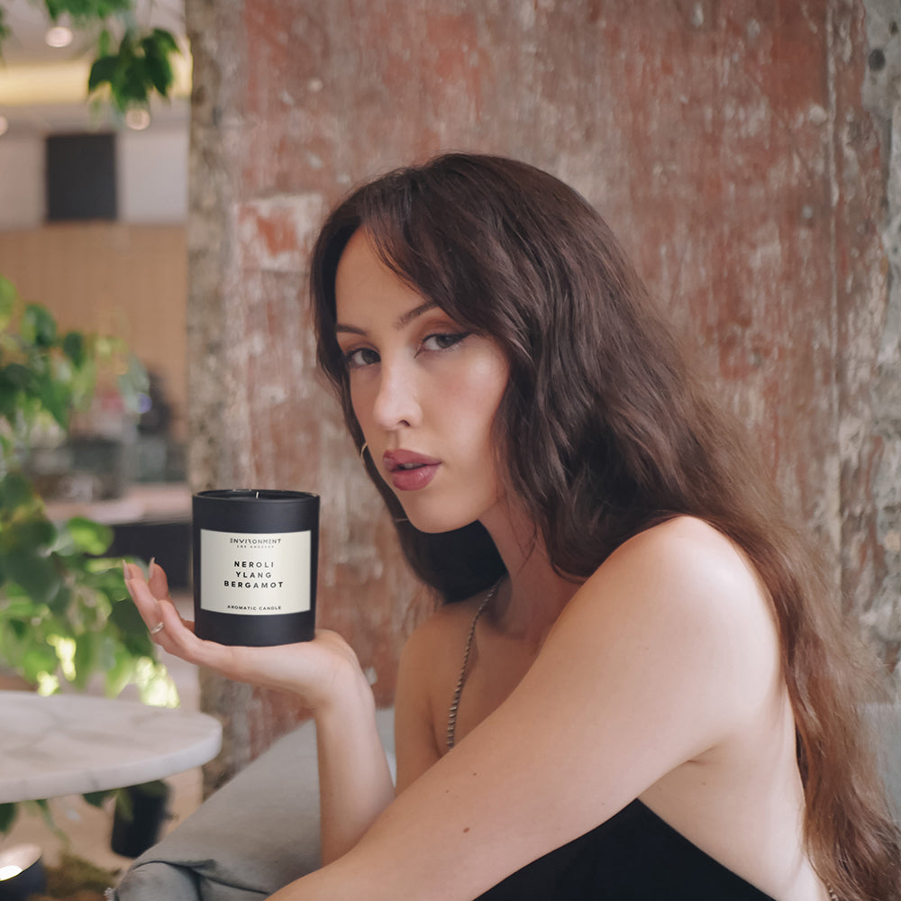 Woman holding a Chanel inspired candle