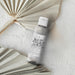 Bottled ritz carlton fragrance oil with a minimalist label on a clean surface.