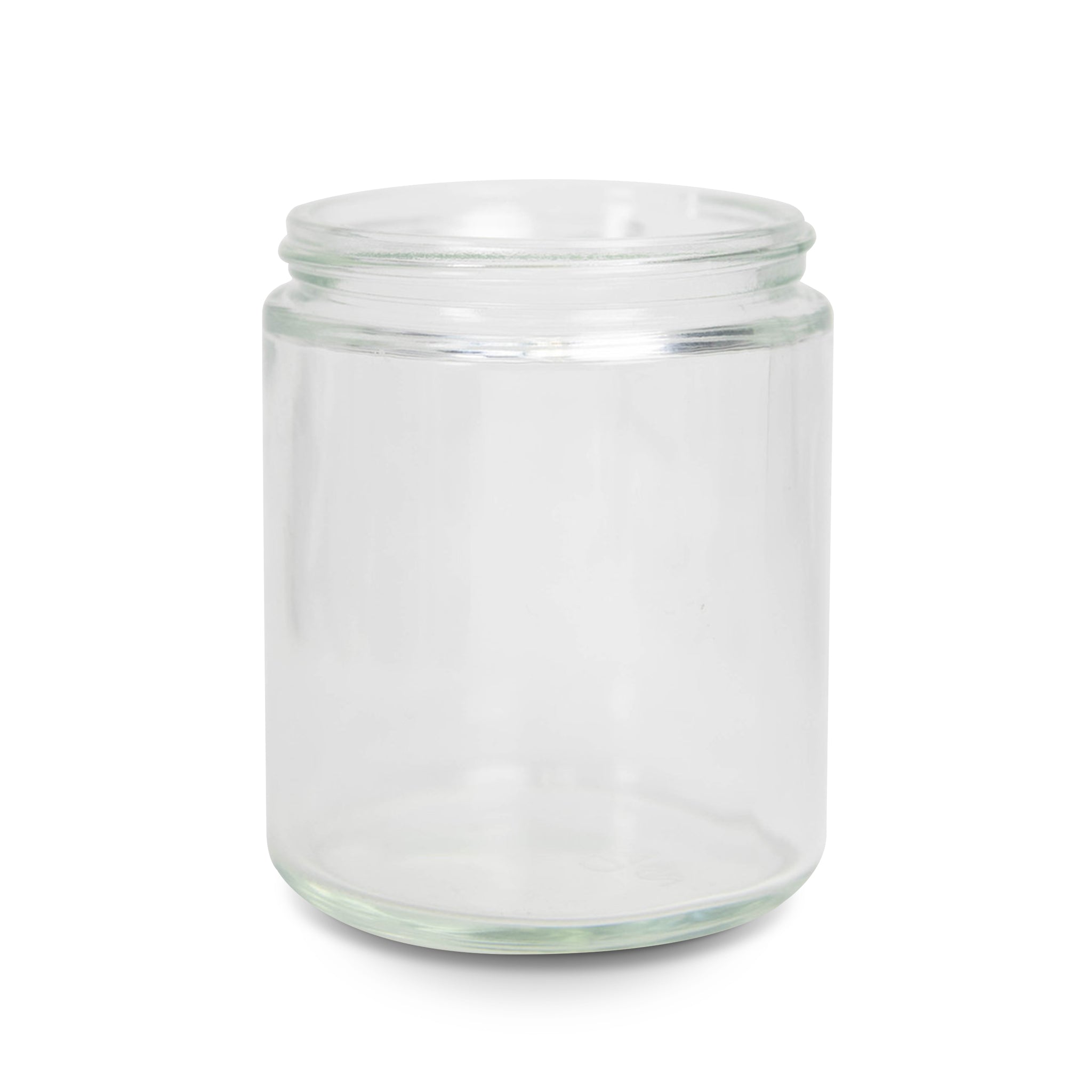 An 8 oz straight-sided jar made of clear colored glass, commonly used for candle making. - Clear Straight Sided Jar